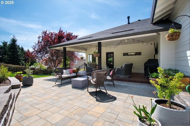view of patio with outdoor lounge area and a wooden deck