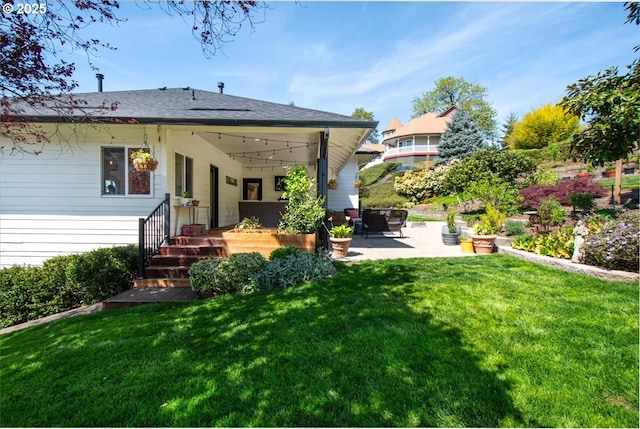 back of property featuring a patio and a yard