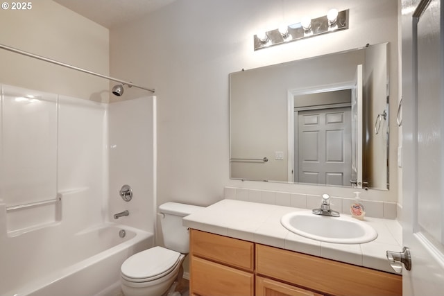 bathroom with shower / tub combination, vanity, and toilet