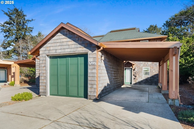 view of front facade featuring a garage and a carport