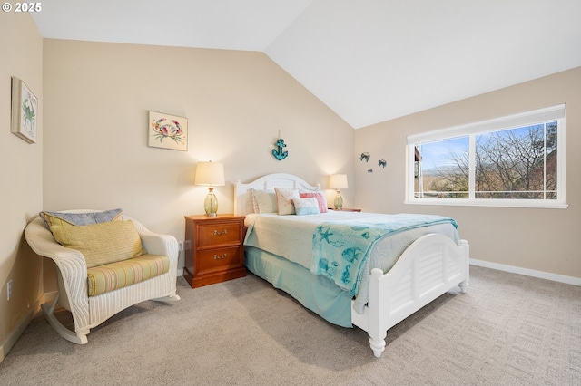 carpeted bedroom with vaulted ceiling and baseboards