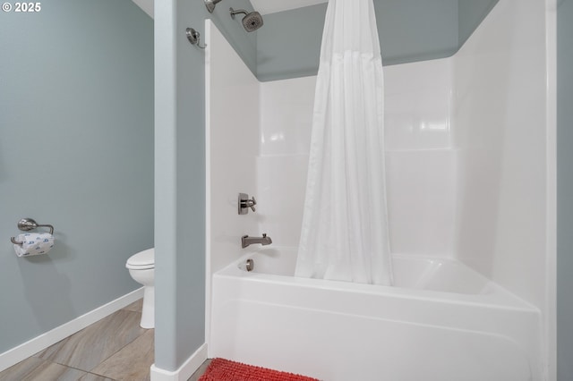 bathroom featuring shower / bath combination with curtain, tile patterned floors, and toilet