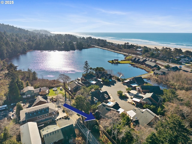 birds eye view of property featuring a water view