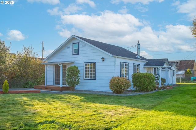 276 S 21st St, Reedsport, OR 97467 - rear view of property with a lawn and roof with shingles