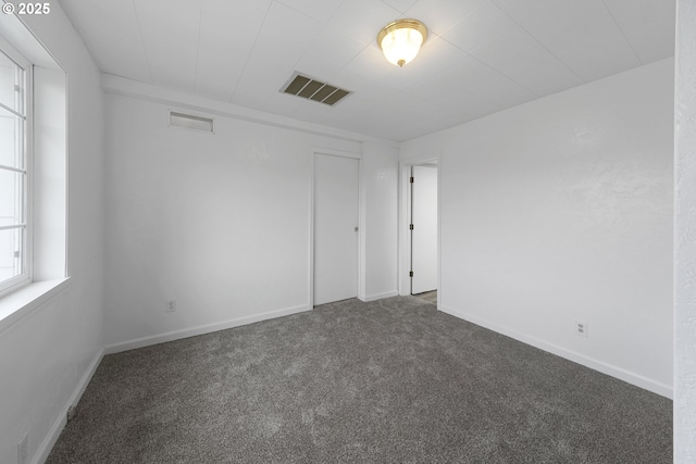 276 S 21st St, Reedsport, OR 97467 - empty room with dark colored carpet and baseboards