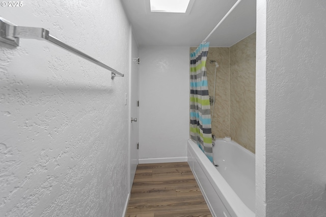 276 S 21st St, Reedsport, OR 97467 - bathroom with shower / bath combo, wood finished floors, a textured wall, and baseboards