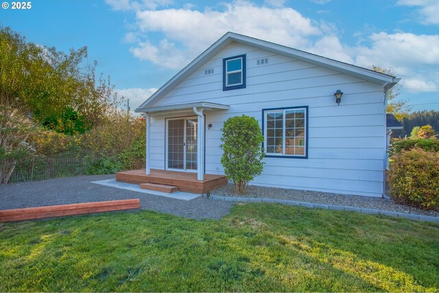 276 S 21st St, Reedsport, OR 97467 - rear view of house featuring a lawn