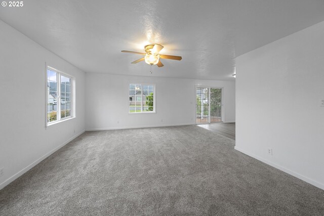 276 S 21st St, Reedsport, OR 97467 - empty room with carpet, baseboards, and a ceiling fan