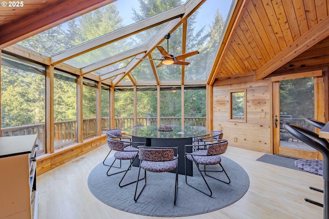 sunroom / solarium featuring wood ceiling, ceiling fan, and vaulted ceiling with beams