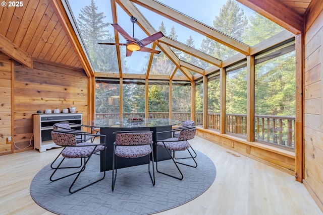 sunroom with wood ceiling, a wealth of natural light, and ceiling fan