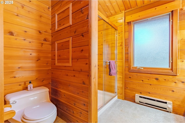 bathroom with a baseboard radiator, wooden walls, and toilet