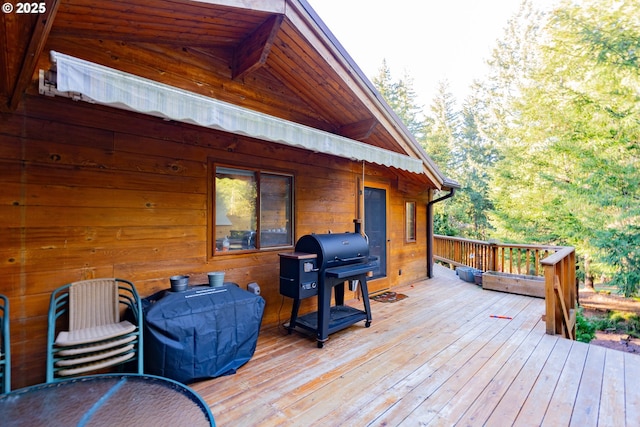 wooden deck with grilling area