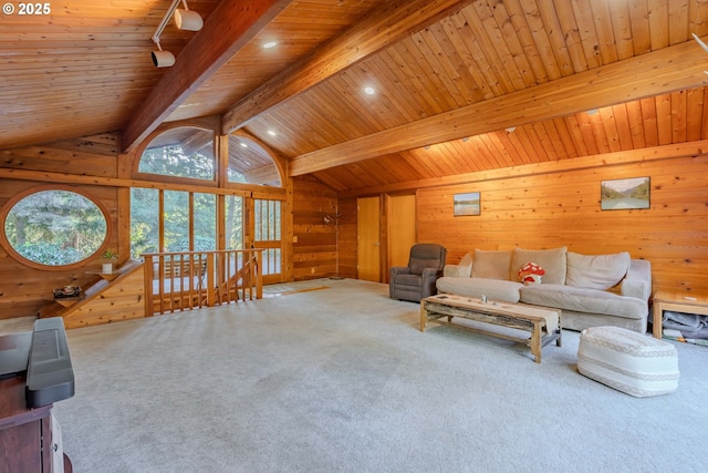 living room featuring carpet flooring, vaulted ceiling with beams, and wood walls