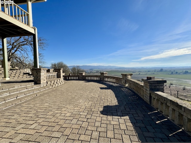 view of patio featuring a water view