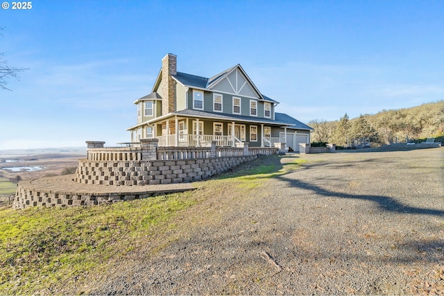 country-style home featuring a garage