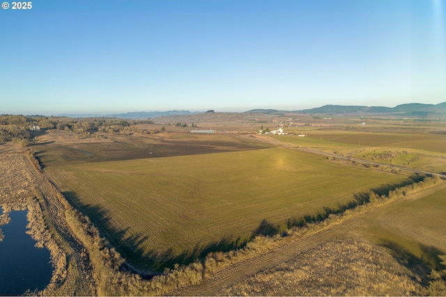 aerial view with a mountain view and a rural view