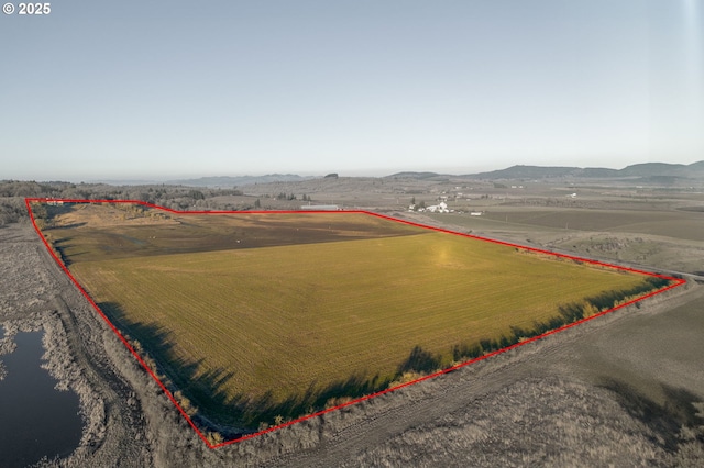 bird's eye view with a mountain view and a rural view