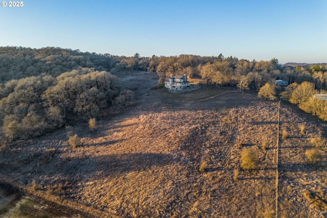 birds eye view of property featuring a rural view