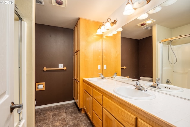 bathroom featuring visible vents and a sink