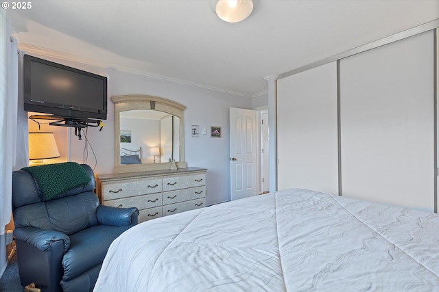4229 SW Beach Ave Unit 27, Lincoln City, OR 97367 - bedroom with crown molding and a closet
