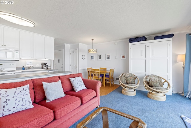 4229 SW Beach Ave Unit 27, Lincoln City, OR 97367 - living room with crown molding, carpet, a textured ceiling, and visible vents