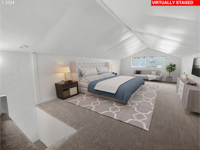 carpeted bedroom featuring vaulted ceiling