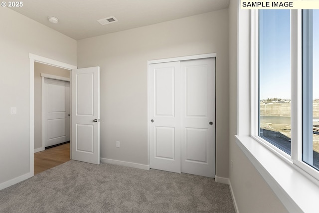 1201 NE Emerald Dr, Hermiston, OR 97838 - unfurnished bedroom featuring carpet floors and a closet