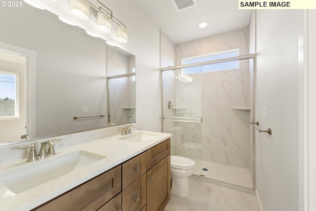 1201 NE Emerald Dr, Hermiston, OR 97838 - bathroom featuring a marble finish shower, double vanity, and marble look tile flooring