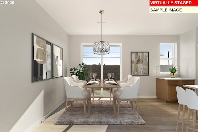 1201 NE Emerald Dr, Hermiston, OR 97838 - dining area featuring light wood-style flooring and a chandelier