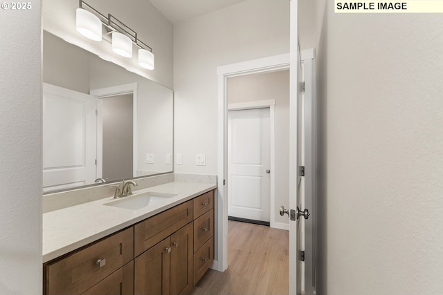 1201 NE Emerald Dr, Hermiston, OR 97838 - bathroom featuring wood finished floors and vanity