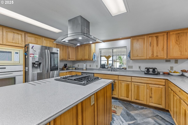 kitchen featuring sink, island range hood, and stainless steel appliances