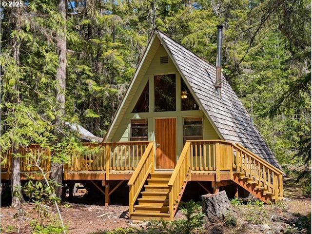 75887 E Rd 28, Rhododendron, OR 97049 - back of property with stairs, a view of trees, and a deck