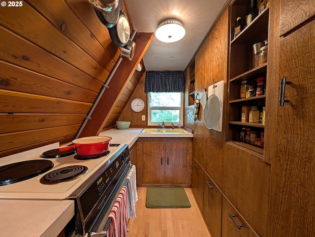 75887 E Rd 28, Rhododendron, OR 97049 - kitchen with electric range, brown cabinets, open shelves, a sink, and light wood-style flooring
