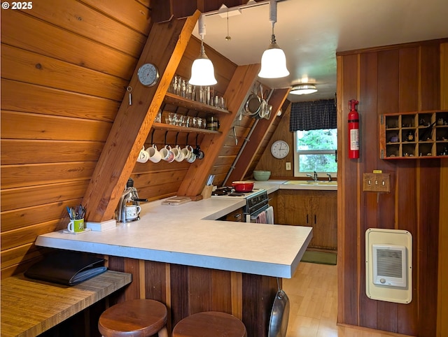 75887 E Rd 28, Rhododendron, OR 97049 - kitchen featuring electric range oven, heating unit, light wood finished floors, a peninsula, and wooden walls