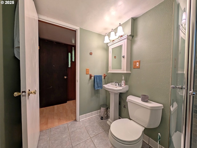 75887 E Rd 28, Rhododendron, OR 97049 - bathroom with tile patterned flooring, toilet, and baseboards