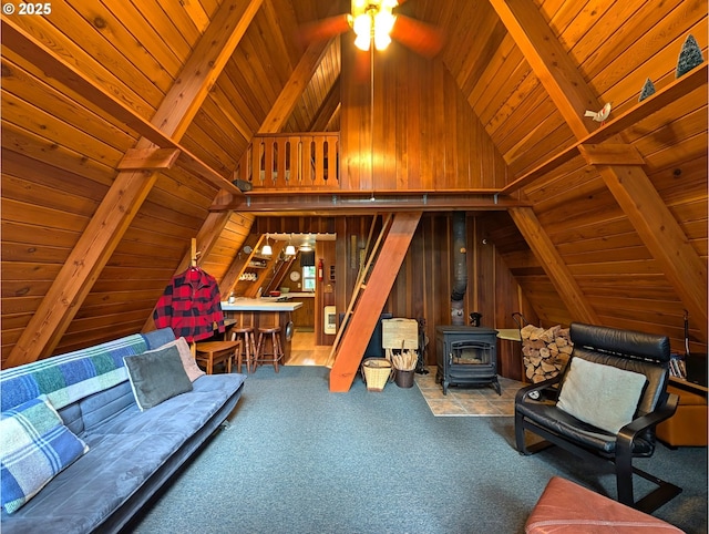 75887 E Rd 28, Rhododendron, OR 97049 - living area featuring wood ceiling, a wood stove, a ceiling fan, wood walls, and carpet