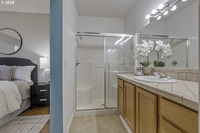 bathroom with vanity and an enclosed shower