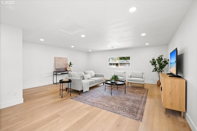 living room with attic access, light wood-style floors, recessed lighting, and baseboards