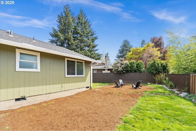 view of yard with an outdoor fire pit