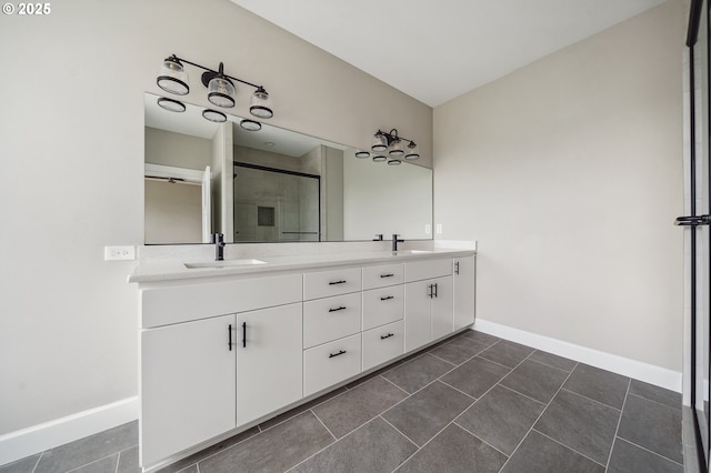 bathroom with tile patterned flooring, vanity, and walk in shower