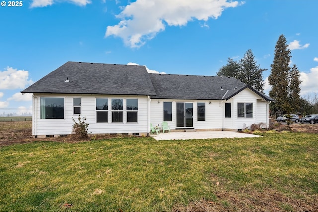 rear view of property with a yard and a patio area