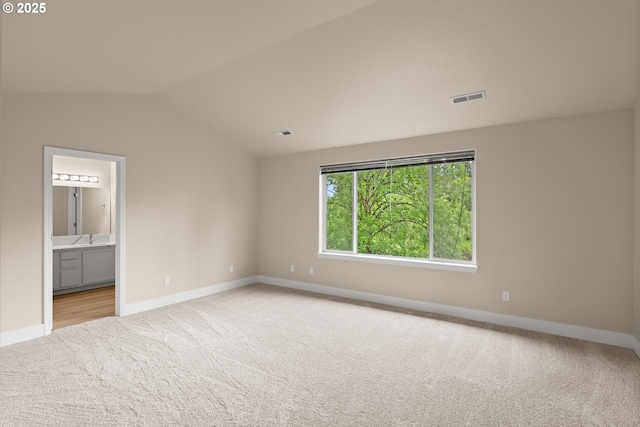 111 SE 49th Ct, Hillsboro, OR 97123 - carpeted spare room featuring baseboards, lofted ceiling, and a sink