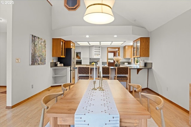 dining space featuring sink and light hardwood / wood-style flooring