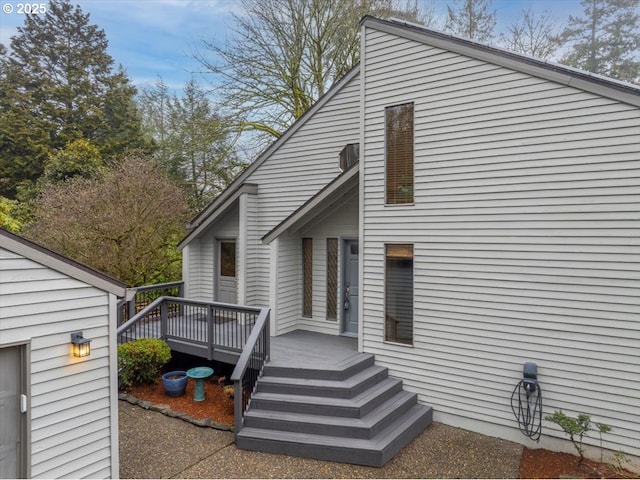 view of side of property featuring a deck