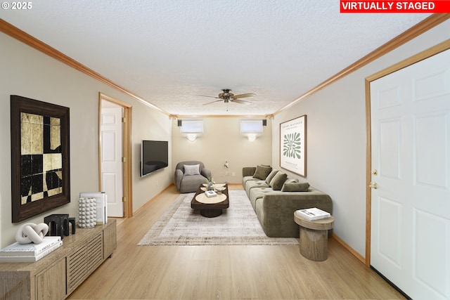 17445 S Beckman Rd, Oregon City, OR 97045 - living room featuring a ceiling fan, ornamental molding, light wood-style flooring, a textured ceiling, and baseboards