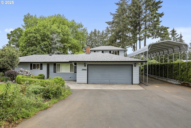 17445 S Beckman Rd, Oregon City, OR 97045 - view of front of home with driveway, a detached carport, a chimney, and a shingled roof