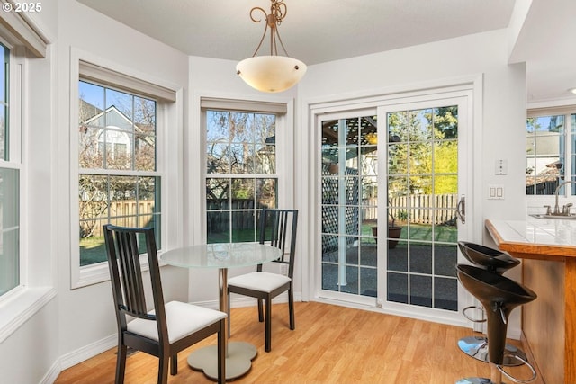 interior space with sink and light hardwood / wood-style floors