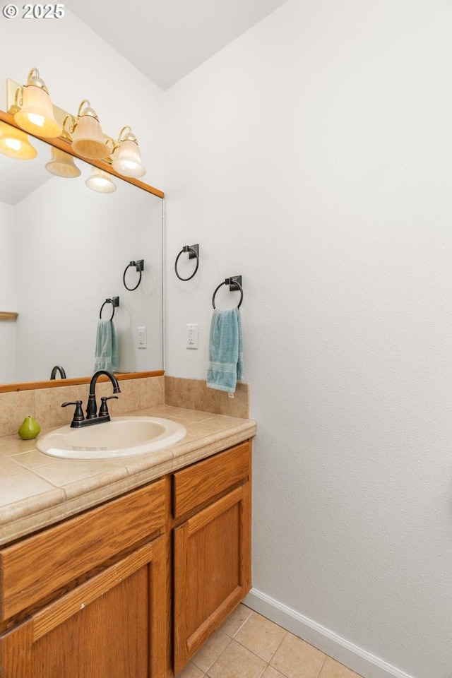 bathroom featuring tile patterned flooring and vanity