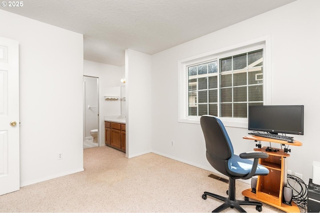 office space with a textured ceiling