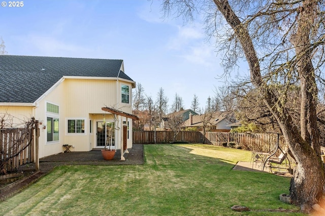 back of property featuring a yard and a patio area